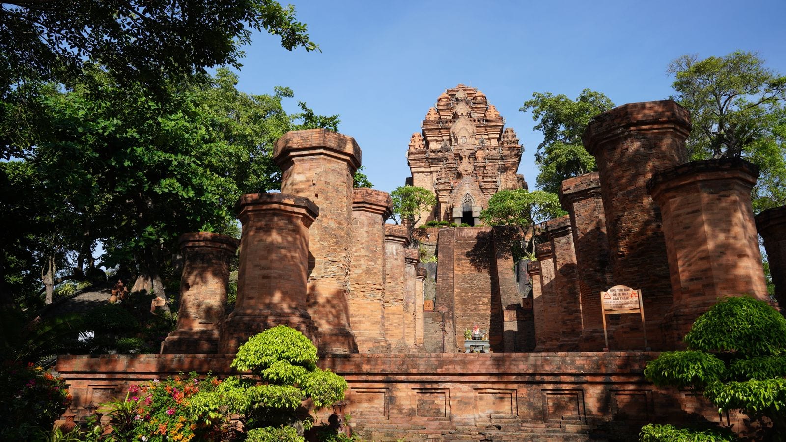 The Po Nagar towers on their terrace, a row of squat brick pillars in front of the main tower, with a small altar under the doorway